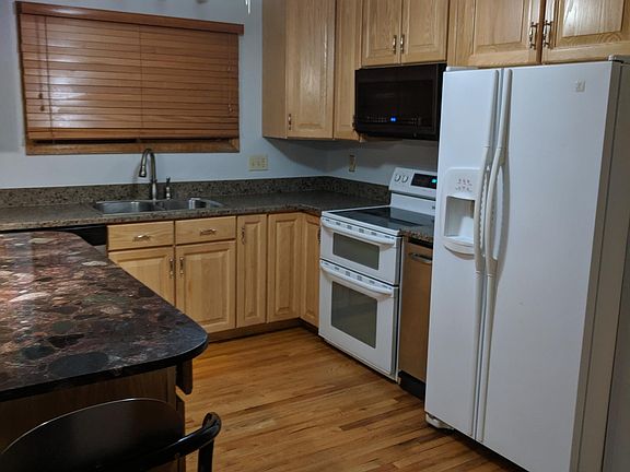 Remodeled kitchen, built-in microwave, double oven, refrigerator with ice and water in the door, trash compactor, pantry with drawers, granite eat-in island with seating for 4 people, ceiling fan