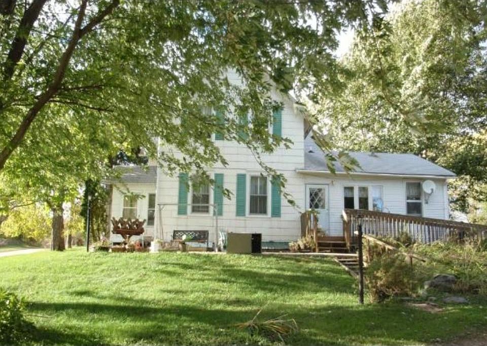 NEARLY 10 ACRES-ORIGINAL FARMHOUSE. Apple orchard along the side. Detached garage on the other side. Handicap accessible ramp to the kitchen. (Stair ramp inside)