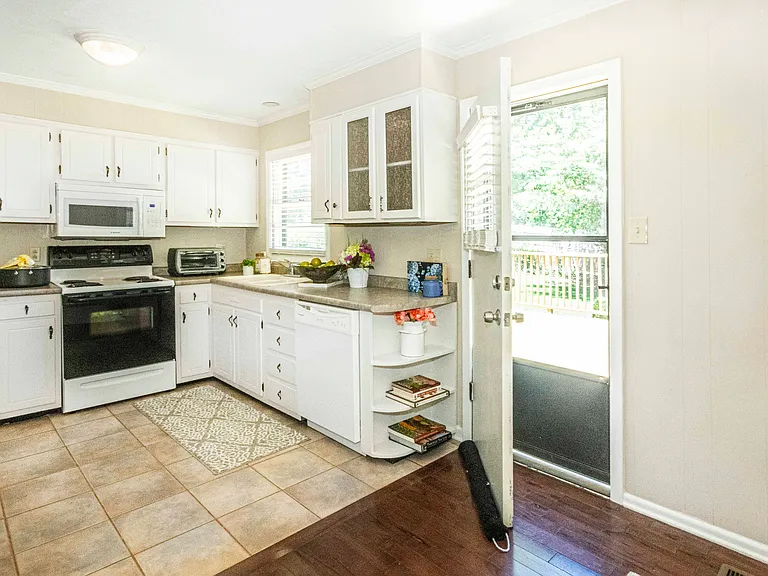 ABUNDANCE of counter space and sheving for cookbooks
Exiting to rear yard off kitchen makes family gatherings or grilling easy