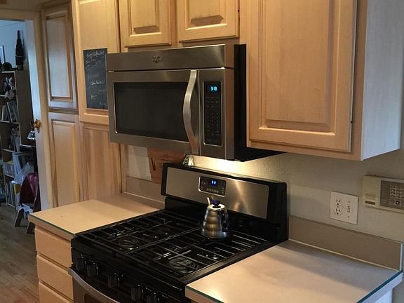Kitchen with 5 burner SS gas oven