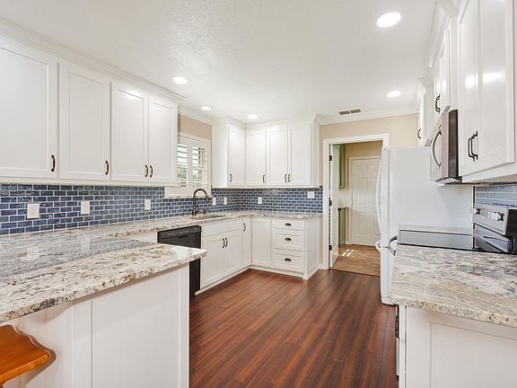 Kitchen with Oven Range, Microwave, Refrigerator/Freezer & Dishwasher