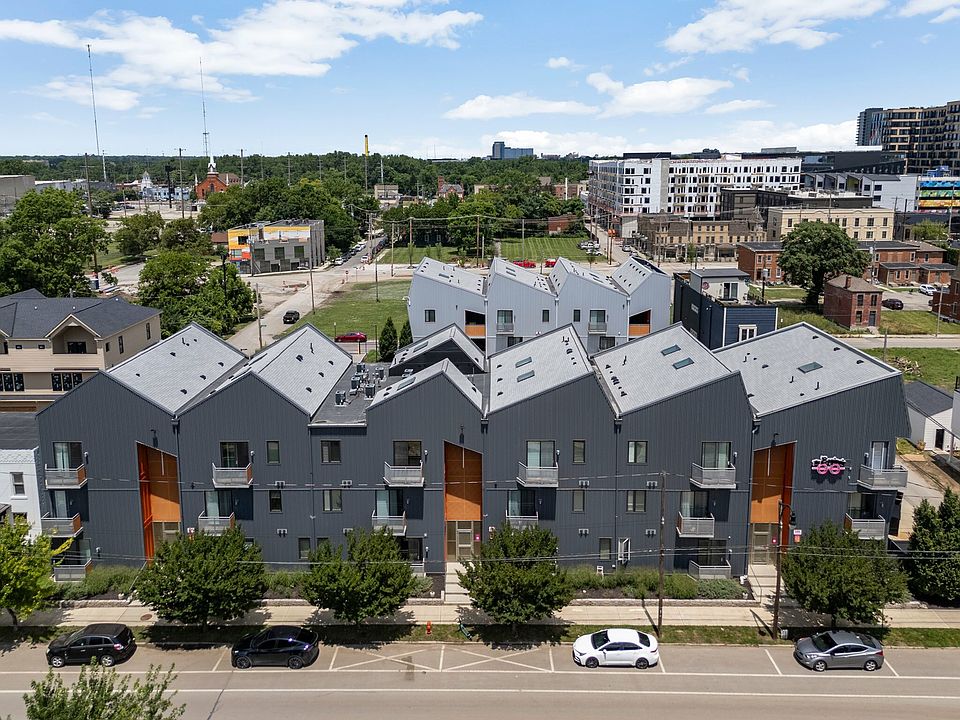 Modern urban apartment complex with unique angled rooftops