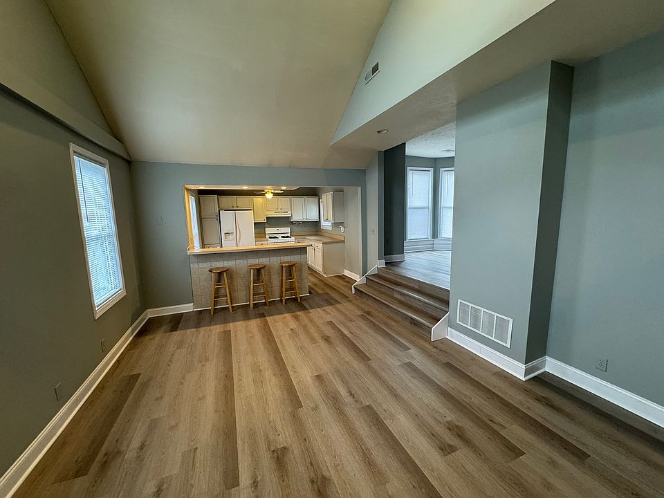 Living space with kitchen in background