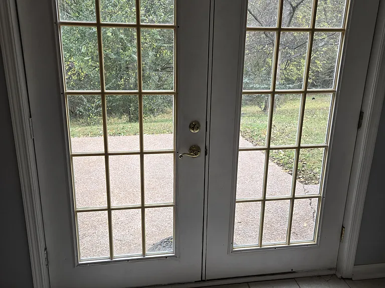 EXIT DOORS FRO DEN TO PATIO. NO BACKYARD NEIGHBORS