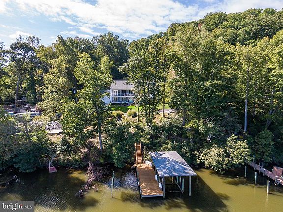 Dock with Covered Boat Slip and Electric Boat Lift