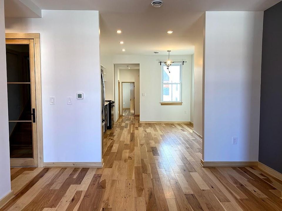Looking from living room into kitchen. Kitchen has plenty of space for a table.