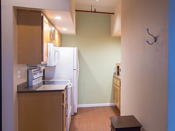 Bright galley kitchen for cooking amazing meals.