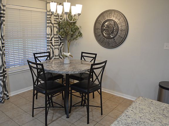 Bright and airy dining room with seating for 4.