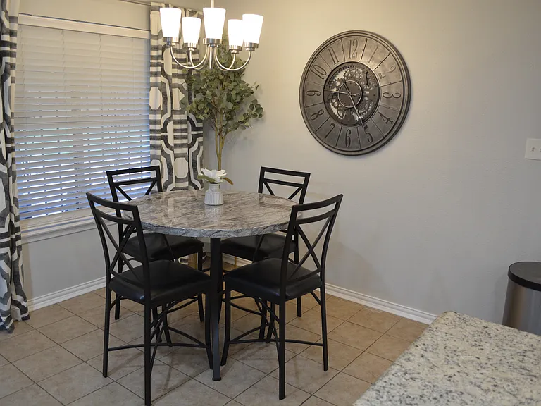 Bright and airy dining room with seating for 4.