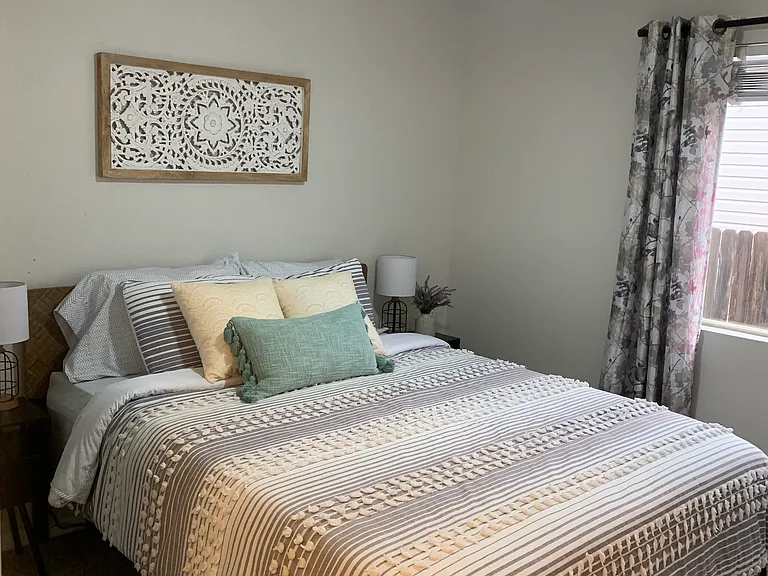 2nd bedroom, with room for a queen bed. Good sized closet and window.