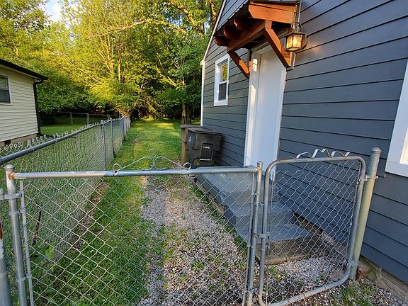 Gates leading to fenced back yard