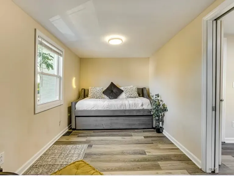 Functional third bedroom featuring a twin bed plus a trundle bed, ideal for accommodating guests or an extra person comfortably.