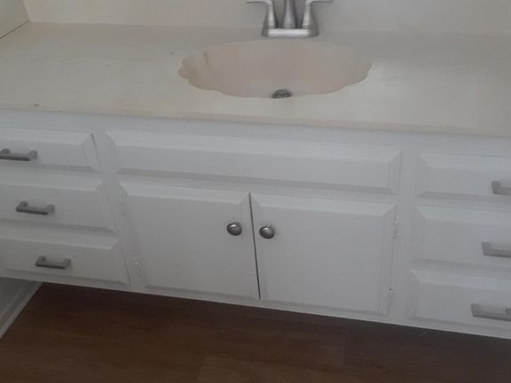 Master bathroom 65_ wide vanity area with beveled-edge full mirror.