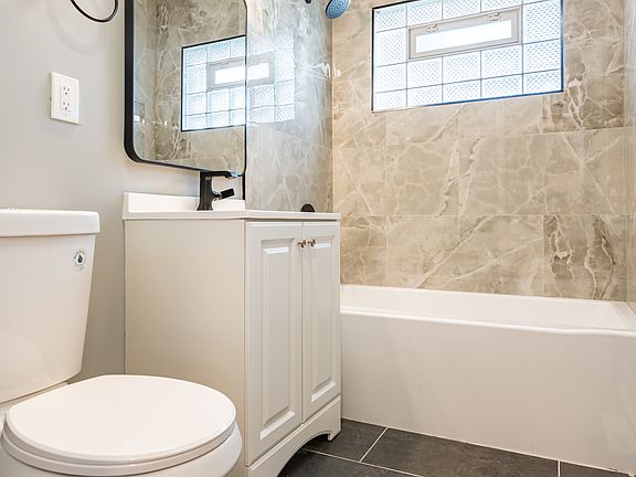 MAIN FLOOR BATHROOM HAS A FULL SIZE BATHTUB/SHOWER!