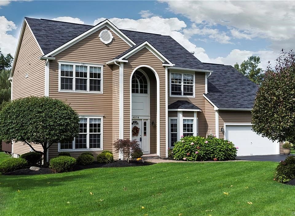 Handsome transitional design by Heritage Homes.  Cedar siding is in perfect condition as is roof which is less than 4 yo.  Driveway sealed in 2015.  Professional landscaping by Fowler.