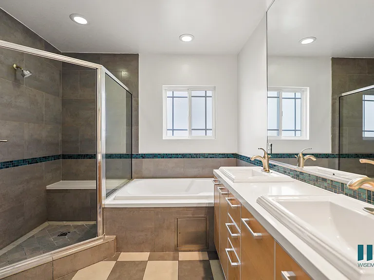 Bathroom with Full-Size Bathtub, Walk-In Shower, and Vanity Cabinet Storage