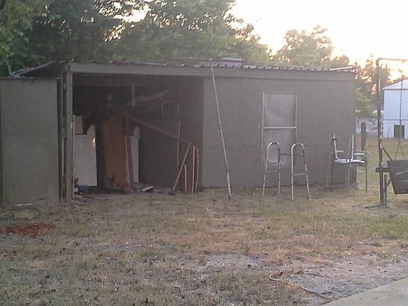 Storage building. Swing and green storage building not inclu