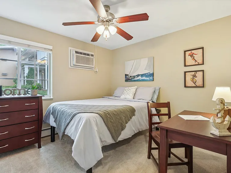 Enjoy a comfortable and furnished bedroom at University Oaks Apartments near Kent State University.