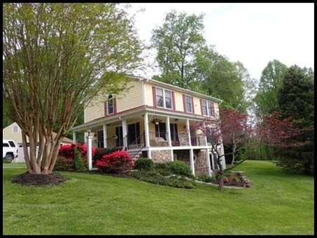 Side Facing StoneMeadow Ln - Shot from beside driveway about two-thirds down drive from street