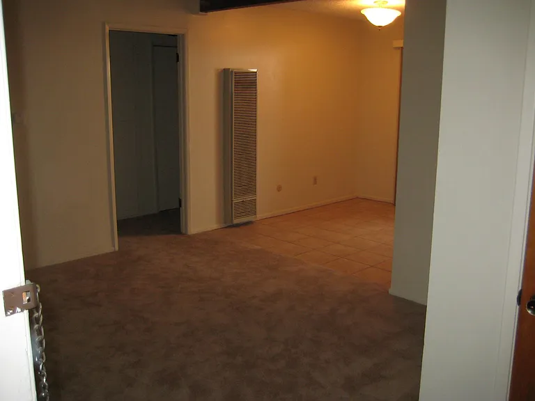 Living room looking toward dining area and hallway