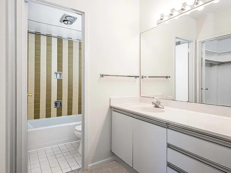Bathrooms with separate vanity space and built-in lighting