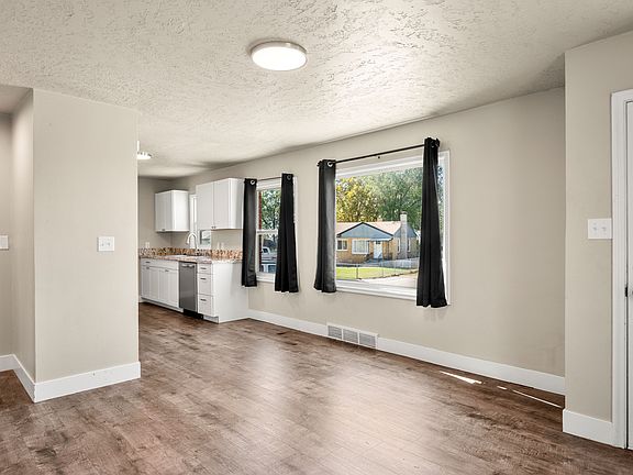 Large picture windows let in natural light for an open and airy feel.