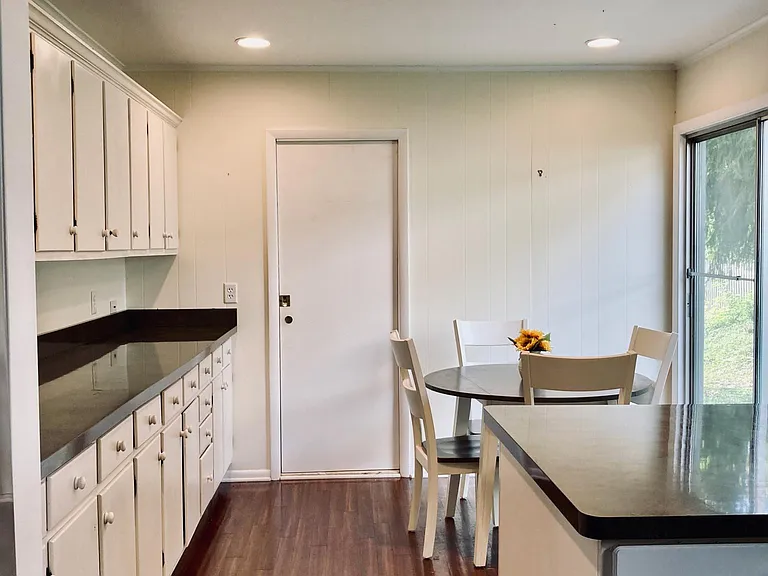 View of the kitchen from the entrance off the living/dining room. The island-style counter provides amble food preparation space.