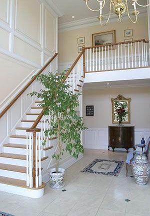 Two-story entance hall with limestone floor