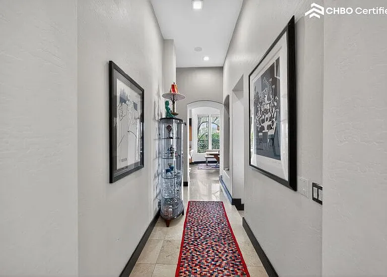 Halway leads to guest wing at opposite end of split floorpl