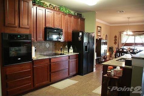 Smooth surface cooktop, wall oven, microwave, and dishwasher.