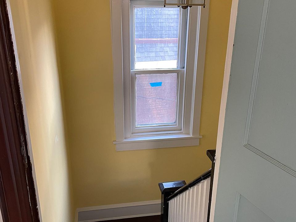 Steps into apartment.