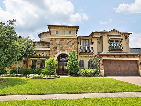 147 Oak Estates Drive in an exclusive gated community of Oak Estates at Jacobs Reserve. An amazing Tuscan styled home with beautiful stone and stucco exterior, Juliet balconies and paver stone driveway all say welcome home! Located just minutes from 