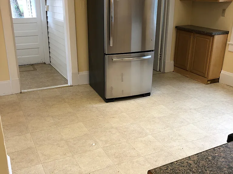 Kitchen looking towards Laundry Room, Rear Apartment Entrance, and 3rd Bedroom entrances.