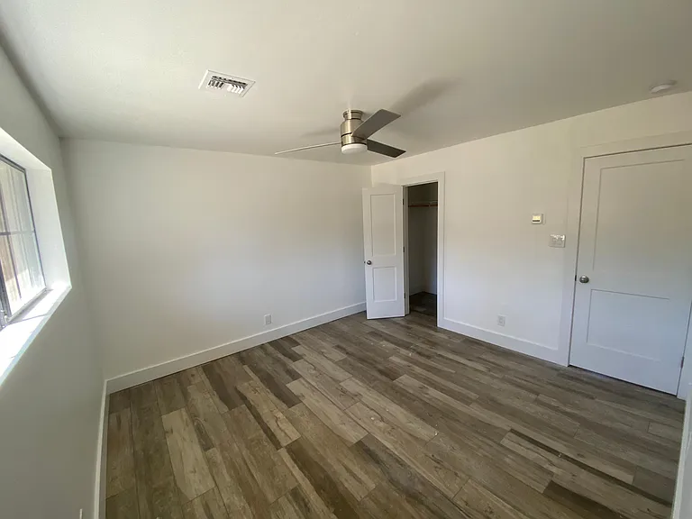 master bedroom with wall in closet