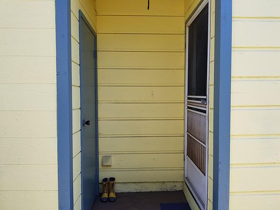 Front door on right and bonus room on left