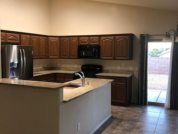 Kitchen area with sink in island