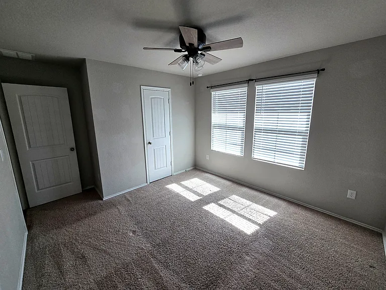 Bedroom 2: Well-sized bedroom ideal for guests, roommates, or office space.