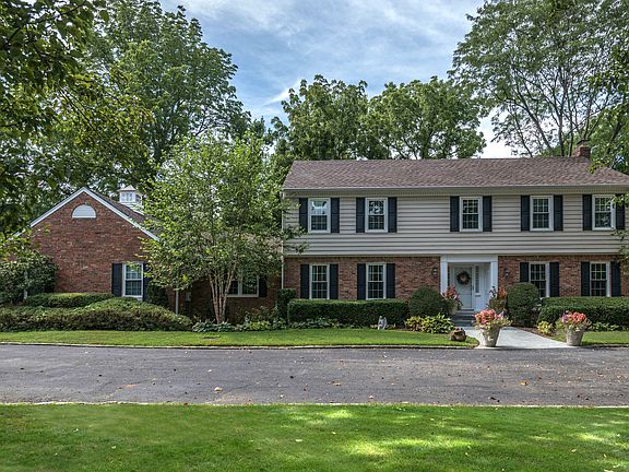 this perfect center hall Colonial is near path to beach!