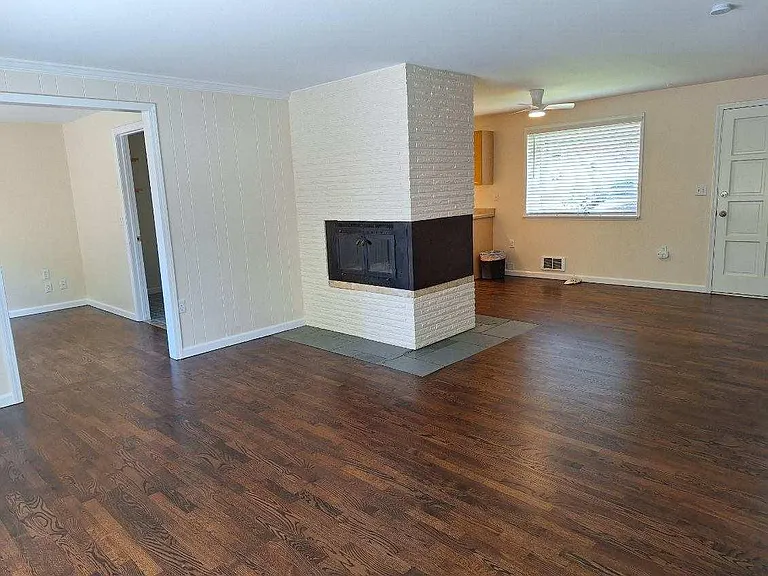 Two-sided fireplace with heat-a-lator