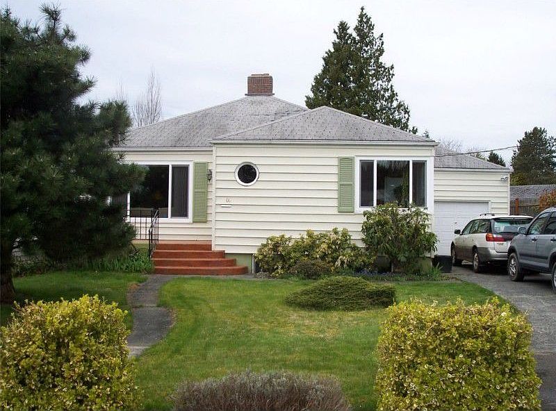 Classic home with Character and attached garage in the prime Columbia Neighborhood, just accross the street from Cornwall Park