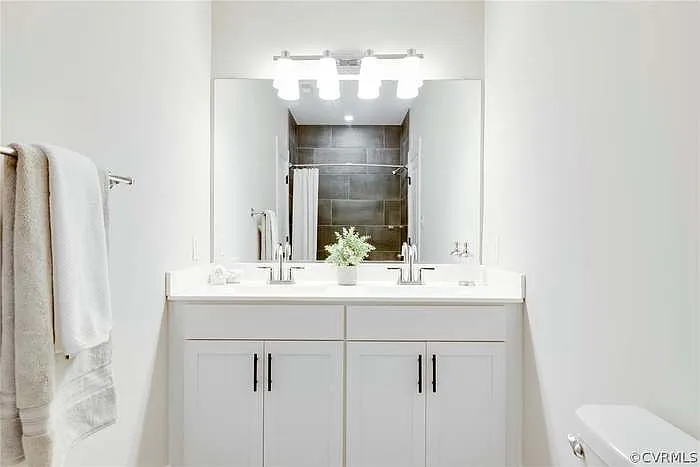 Upstairs, Jack and Jill bathroom. Located between bedroom 2 & 3.