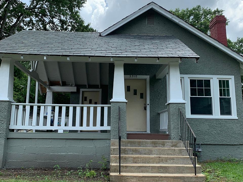 Freshly painted exterior with large front porch.
