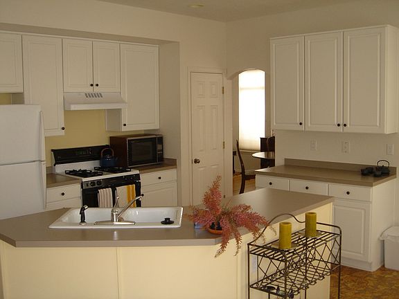 Open kitchen with newer CORK flooring. Beautiful and EZ to clean.