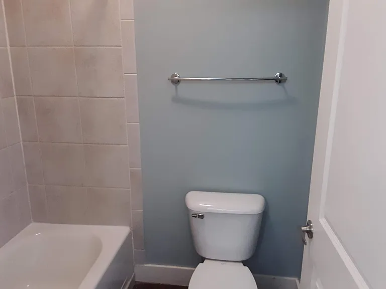Master Bathroom with separate tub and toilet area