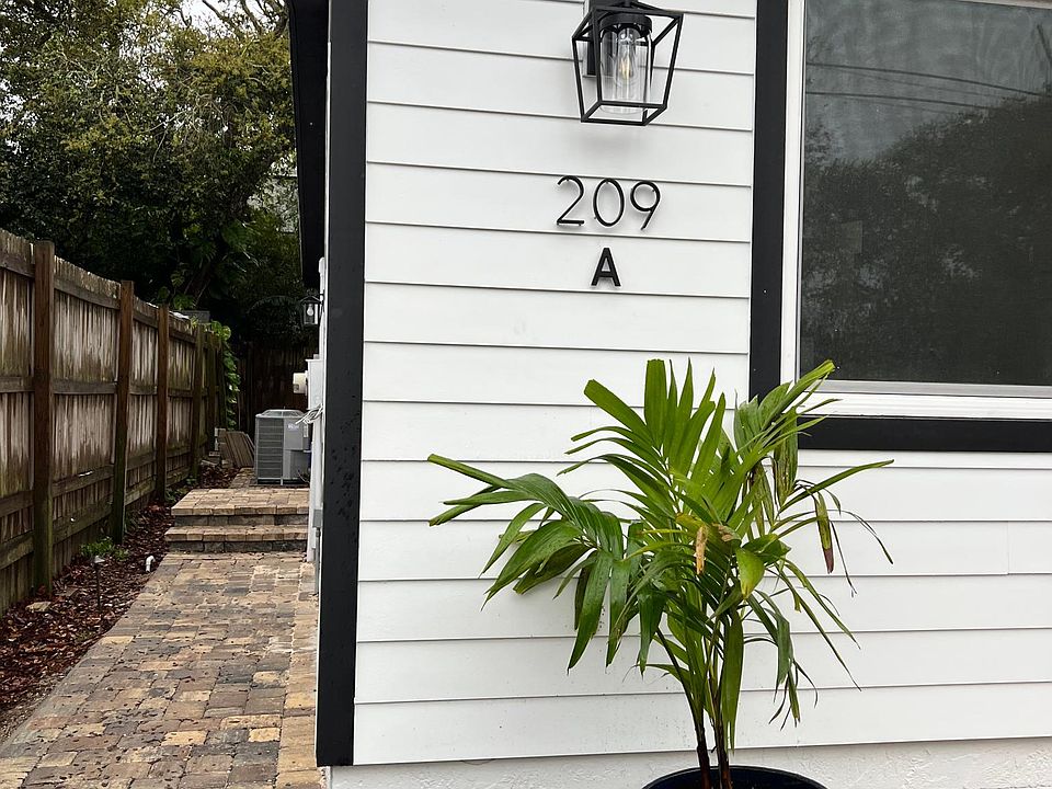 Paver path to front door on side A. House built up on cinderblock so no concerns with flooding.