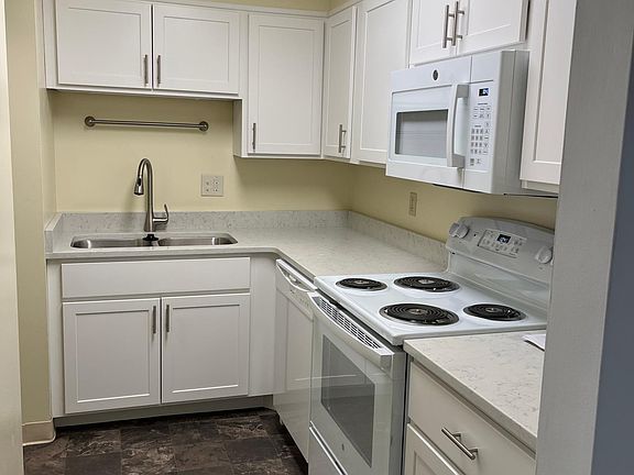 Totally renovated kitchen with quartz countertops.