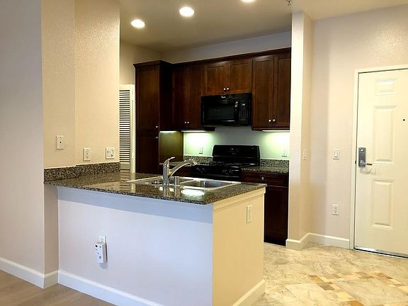 Kitchen with granite counter tops, new stove top and new til