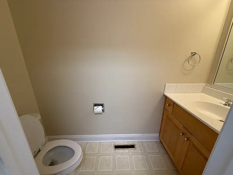 Powder room near laundry room and garage entry
