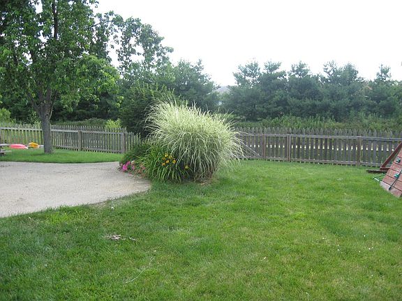Fenced backyard on the pond