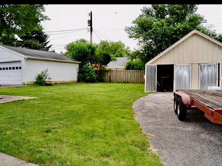 We have added a fence since taking this photo - the backyard is completely fenced in!